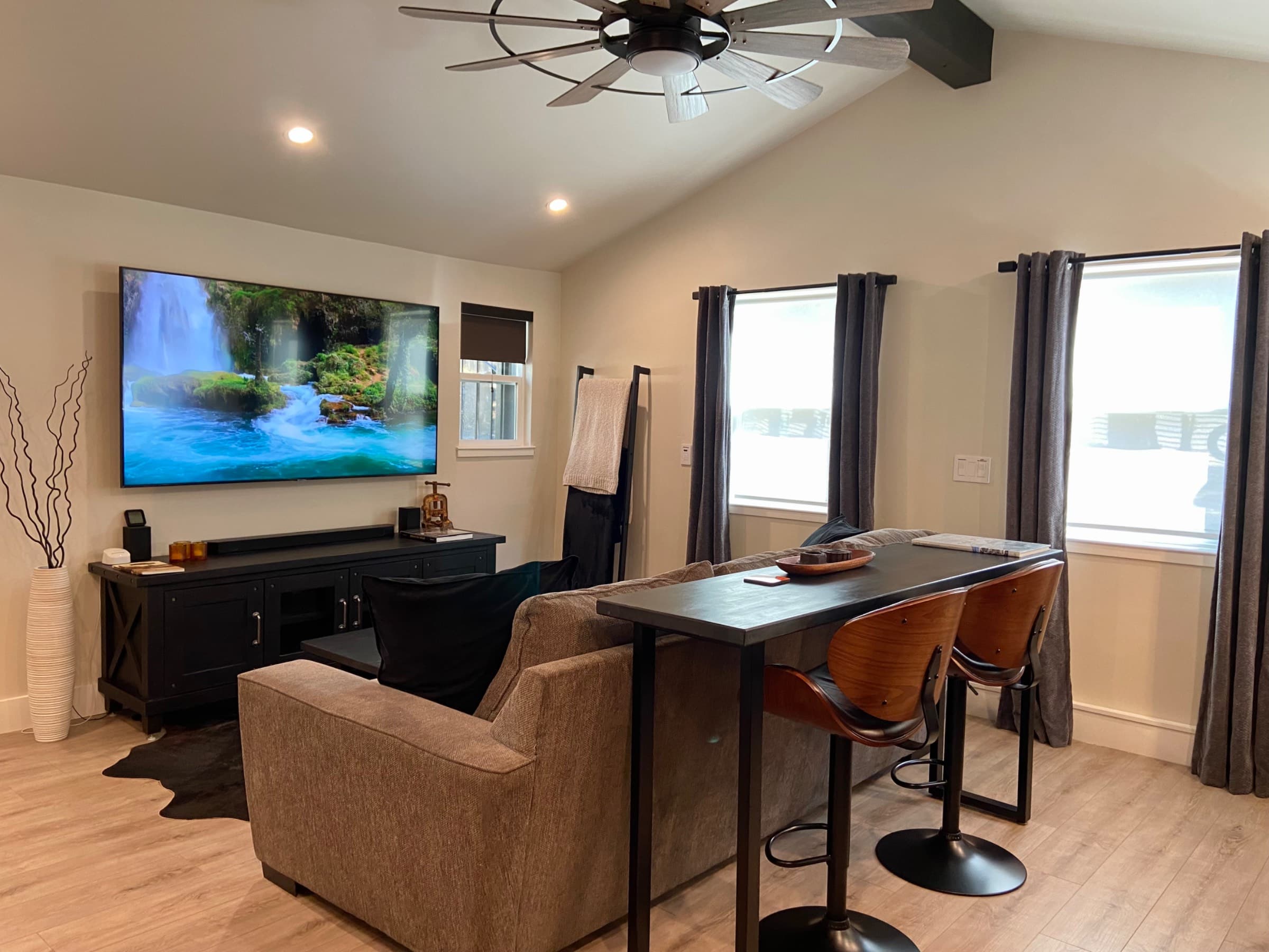 75" Samsung smart tv, pre-loaded with apps. 4.0 sound system with a sound bar and a subwoofer. Man-sized couch that's perfect for lounging or napping.